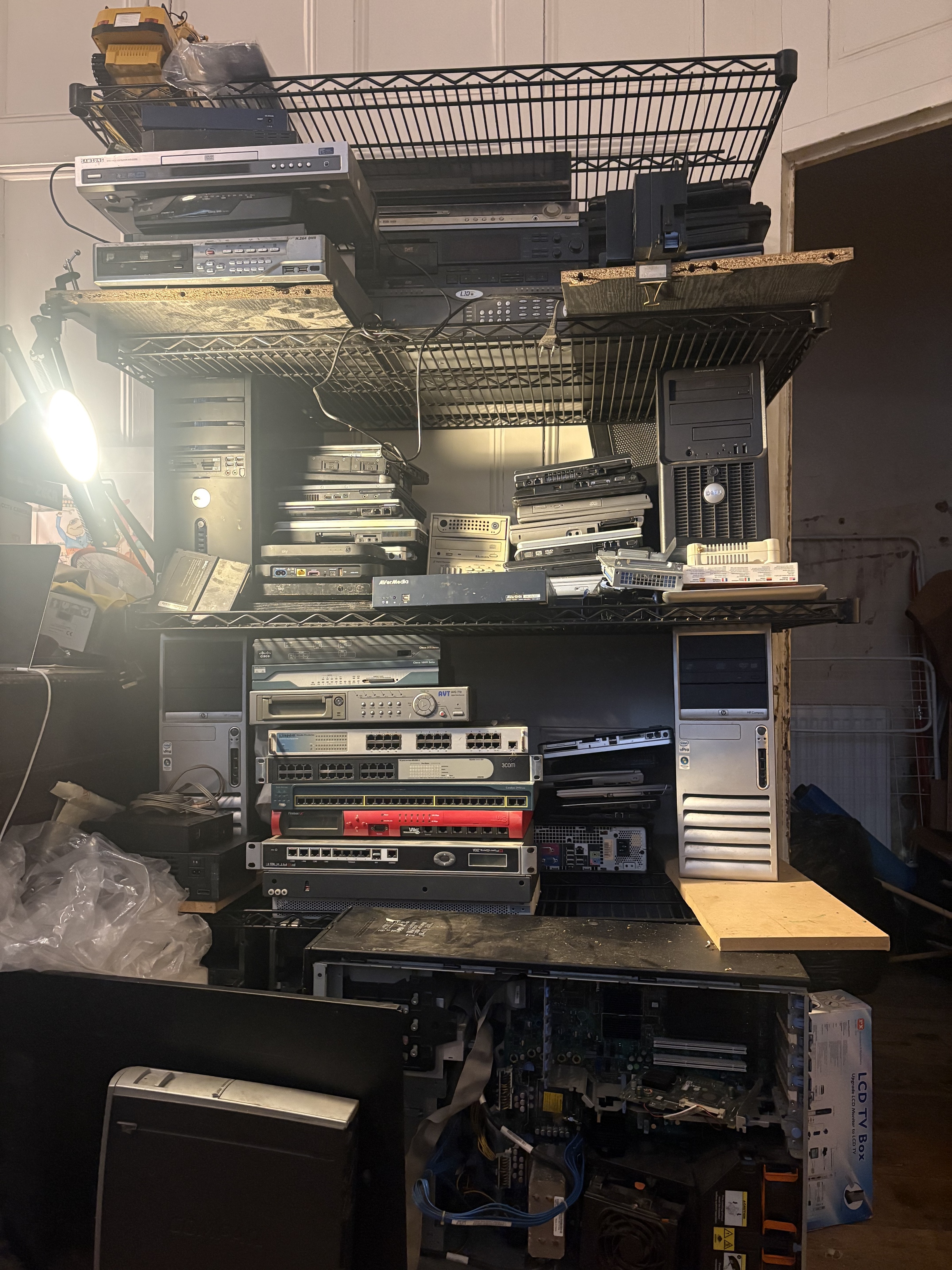 The actual wall of older computers and networking equipment collected for reuse.